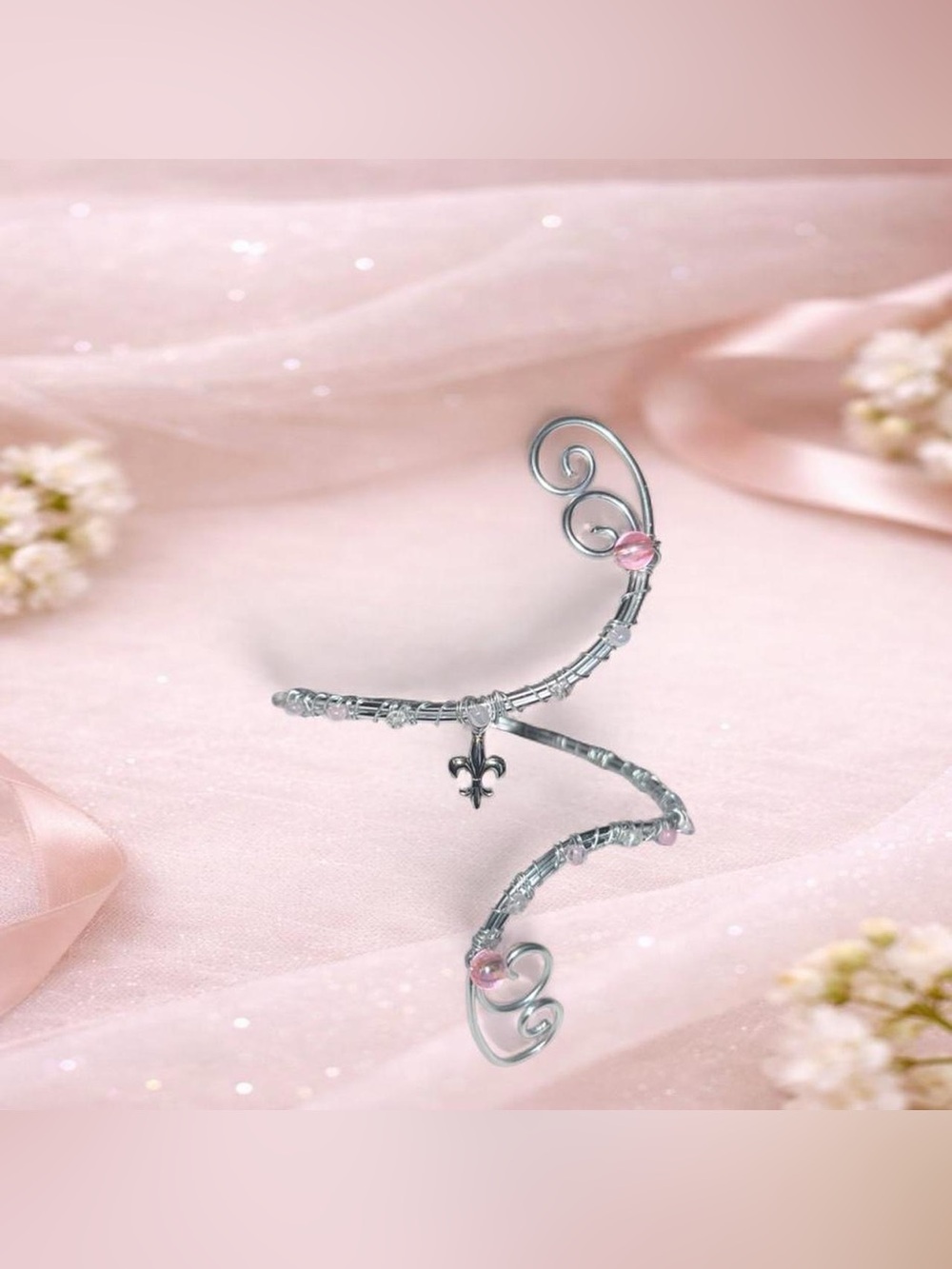 Pink & white armcuff with a central fleur-de-lis charm🌷